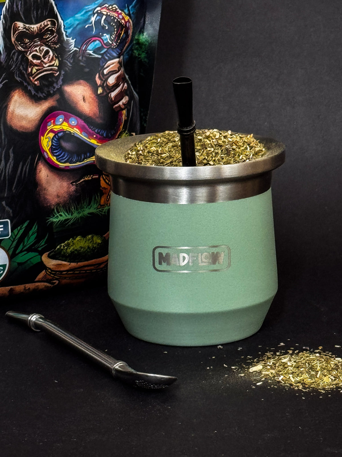 MADFLOW Forest Green mate cup with bombilla next to the Cosmic Mate gift tube