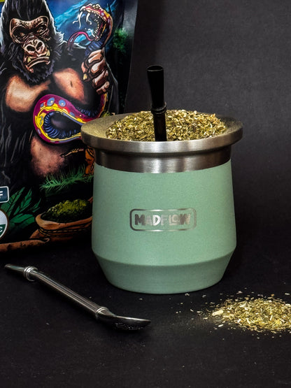 MADFLOW Forest Green mate cup with bombilla next to the Cosmic Mate gift tube