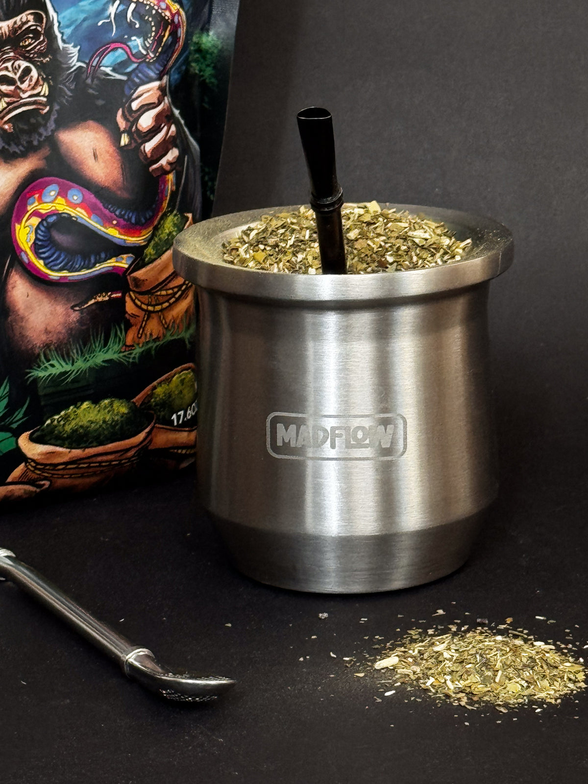 MADFLOW Polished Steel mate cup filled with yerba next to the loose leaf bag
