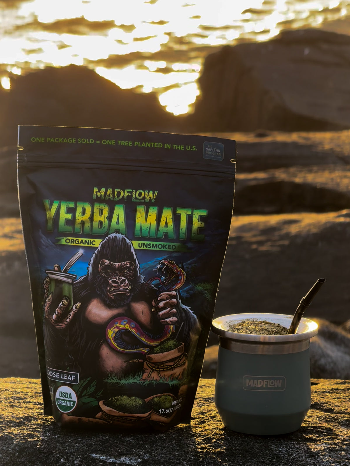 MADFLOW loose leaf yerba mate bag and mate cup on the rocks at sunset